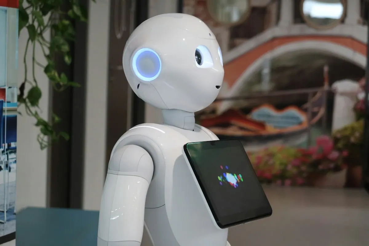 Humanoid robot holding a tablet